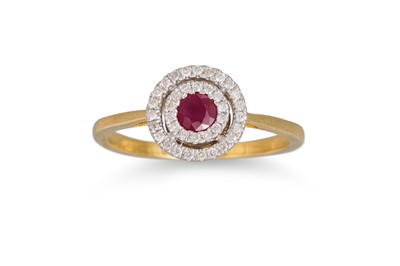 Lot 34 - A RUBY AND DIAMOND CLUSTER RING, the oval ruby...