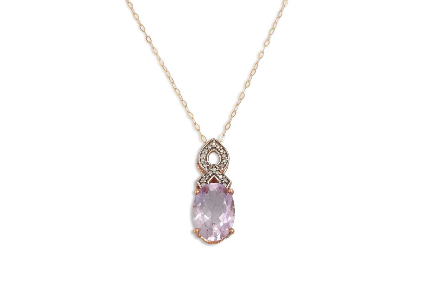 Lot 45 - A DIAMOND AND AMETHYST PENDANT, the oval...
