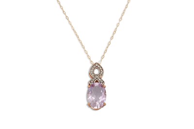 Lot 45 - A DIAMOND AND AMETHYST PENDANT, the oval...