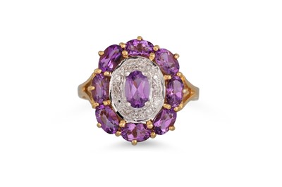 Lot 50 - AN AMETHYST AND DIAMOND CLUSTER RING, the oval...
