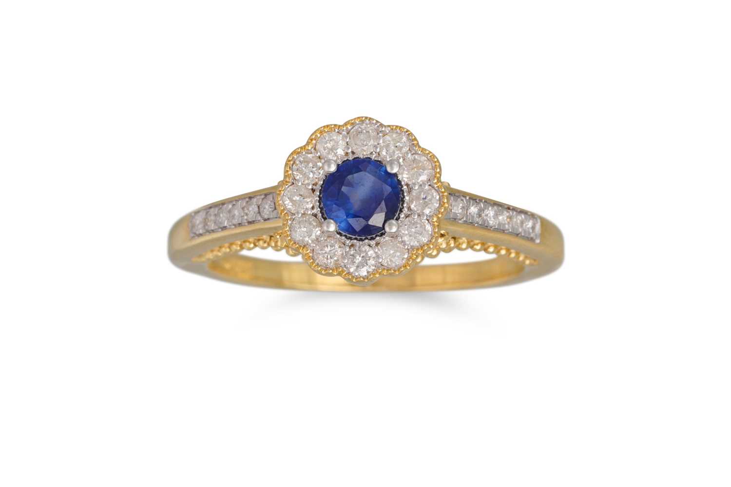 Lot 91 - A DIAMOND AND SAPPHIRE CLUSTER RING, the round...