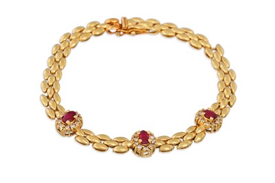 Lot 307 - A RUBY AND DIAMOND CLUSTER BRACELET, mounted...