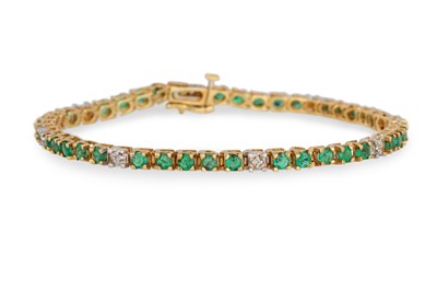 Lot 308 - AN EMERALD AND DIAMOND LINE BRACELET, the...