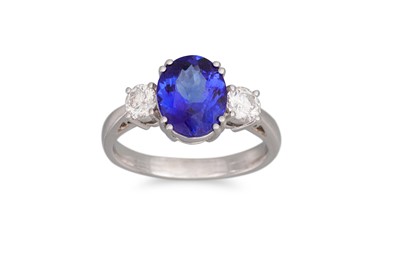 Lot 254 - A TANZANITE AND DIAMOND RING, the oval...