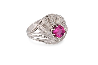 Lot 400 - A RUBY AND DIAMOND RING, of bombé form, the...