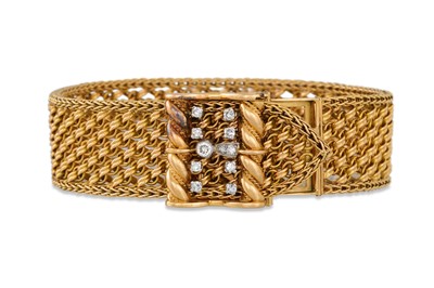 Lot 404 - A MID CENTURY DIAMOND AND GOLD BRACELET, By...