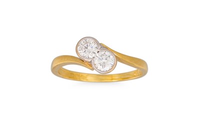 Lot 67 - A TWO STONE DIAMOND RING, of cross-over form,...