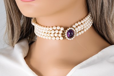 Lot 61 - AN ATTRACTIVE CULTURED PEARL FOUR STRANDED...
