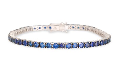 Lot 208 - A SAPPHIRE LINE BRACELET, mounted in 18ct...