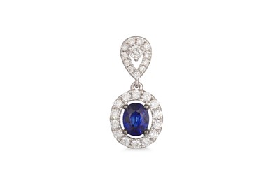 Lot 257 - A DIAMOND AND SAPPHIRE CLUSTER PENDANT, the...