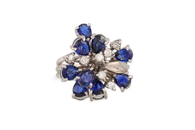 Lot 115 - A DIAMOND AND SAPPHIRE CLUSTER RING, mounted...
