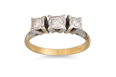 Lot 354 - A THREE STONE DIAMOND RING, the brilliant cut...