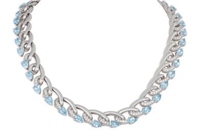 Lot 333 - AN AQUAMARINE AND DIAMOND NECKLACE, mounted in...