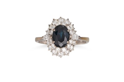 Lot 274 - A SAPPHIRE AND DIAMOND RING, the oval sapphire...