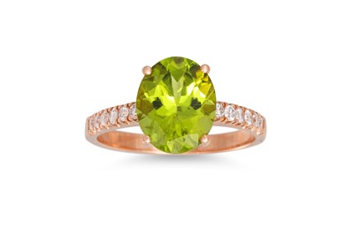 Lot 278 - A PERIDOT AND DIAMOND RING, the oval peridot...