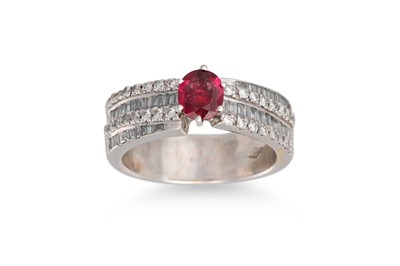 Lot 287 - A RUBY AND DIAMOND RING, the circular ruby to...