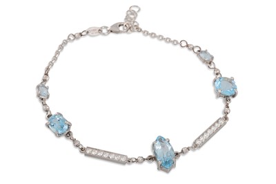 Lot 323 - AN AQUAMARINE AND DIAMOND BRACELET, the three...