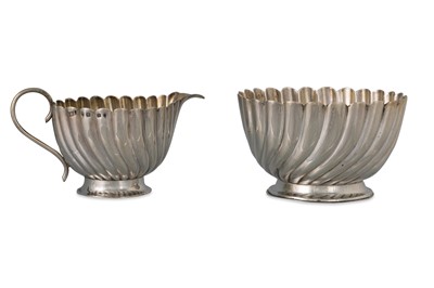 Lot 444 - A VICTORIAN MILK JUG AND SUGAR BOWL, of wavy...