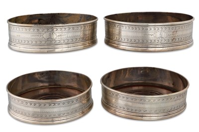 Lot 412 - A SET OF FOUR GEORGIAN IRISH SILVER CIRCULAR...