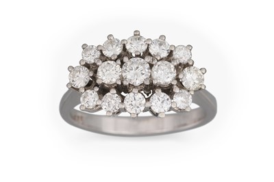Lot 112 - A DIAMOND CLUSTER RING, the round brilliant...