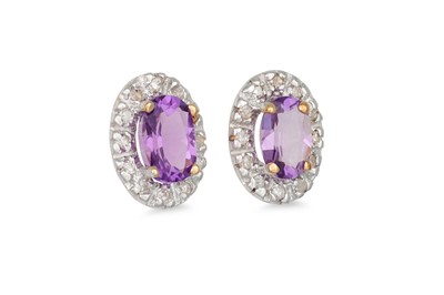 Lot 41 - A PAIR OF DIAMOND AND AMETHYST EARRINGS, the...