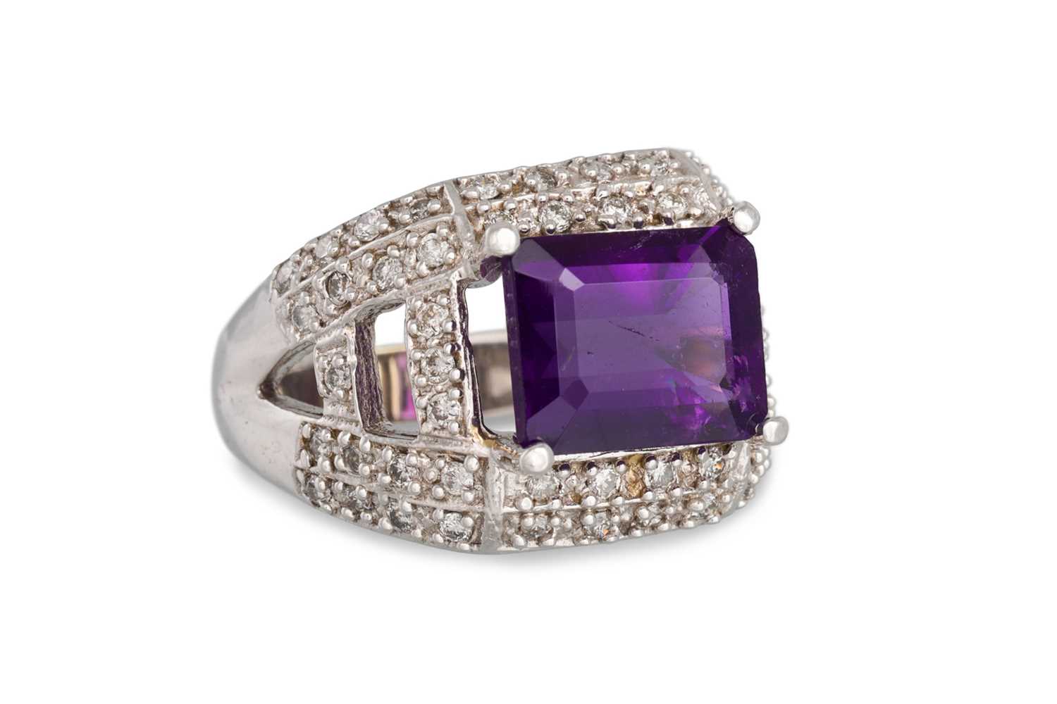 Lot 96 - A DIAMOND AND AMETHYST CLUSTER RING, the...