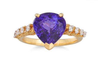 Lot 11 - A TANZANITE AND DIAMOND RING, the pear shaped...