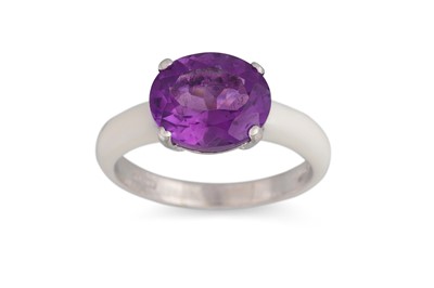 Lot 293 - AN AMETHYST AND ENAMEL RING, the oval amethyst...