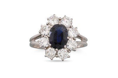 Lot 304 - A SAPPHIRE AND DIAMOND RING, the oval sapphire...