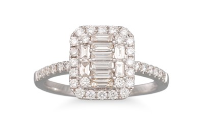 Lot 239 - A DIAMOND CLUSTER RING, the baguette cut...