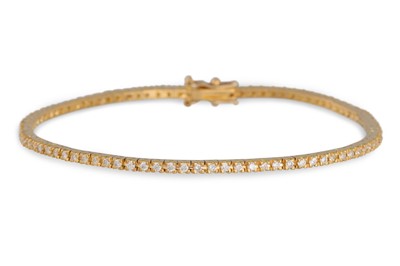 Lot 240 - A DIAMOND LINE BRACELET, the brilliant cut...