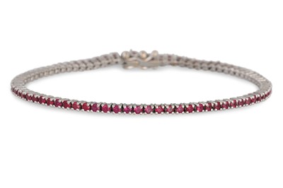 Lot 248 - A RUBY LINE BRACELET, mounted in 18ct white...