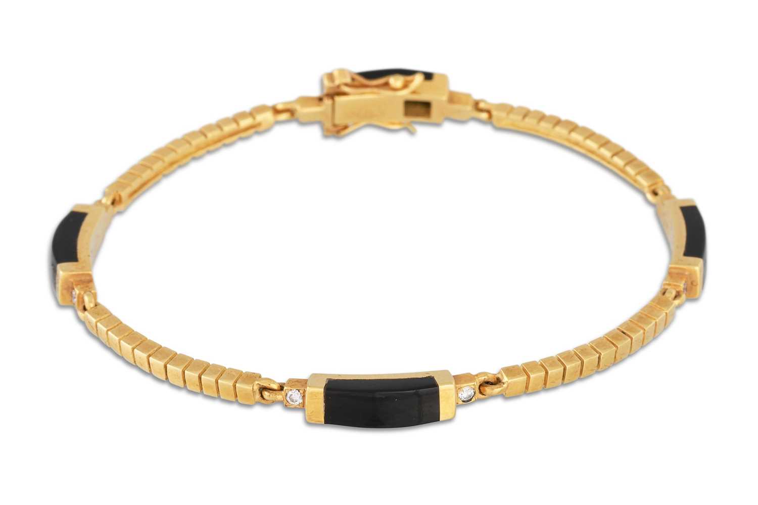 Lot 18 - A DIAMOND AND BLACK CORAL PANEL BRACELET, by...