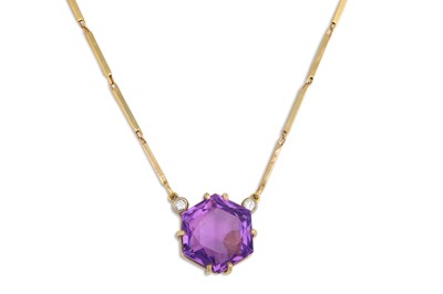 Lot 29 - A LARGE AMETHYST AND DIAMOND PENDANT, to a...