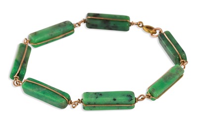 Lot 220 - A GREEN QUARTZ SEVEN PANEL BRACELET, the...