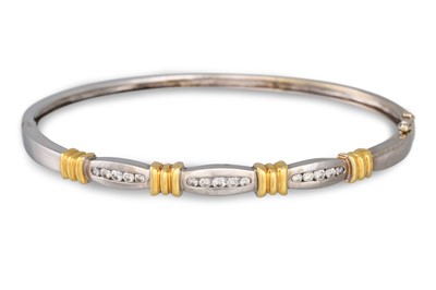 Lot 36 - A DIAMOND SET BANGLE, in two colour 18ct gold,...
