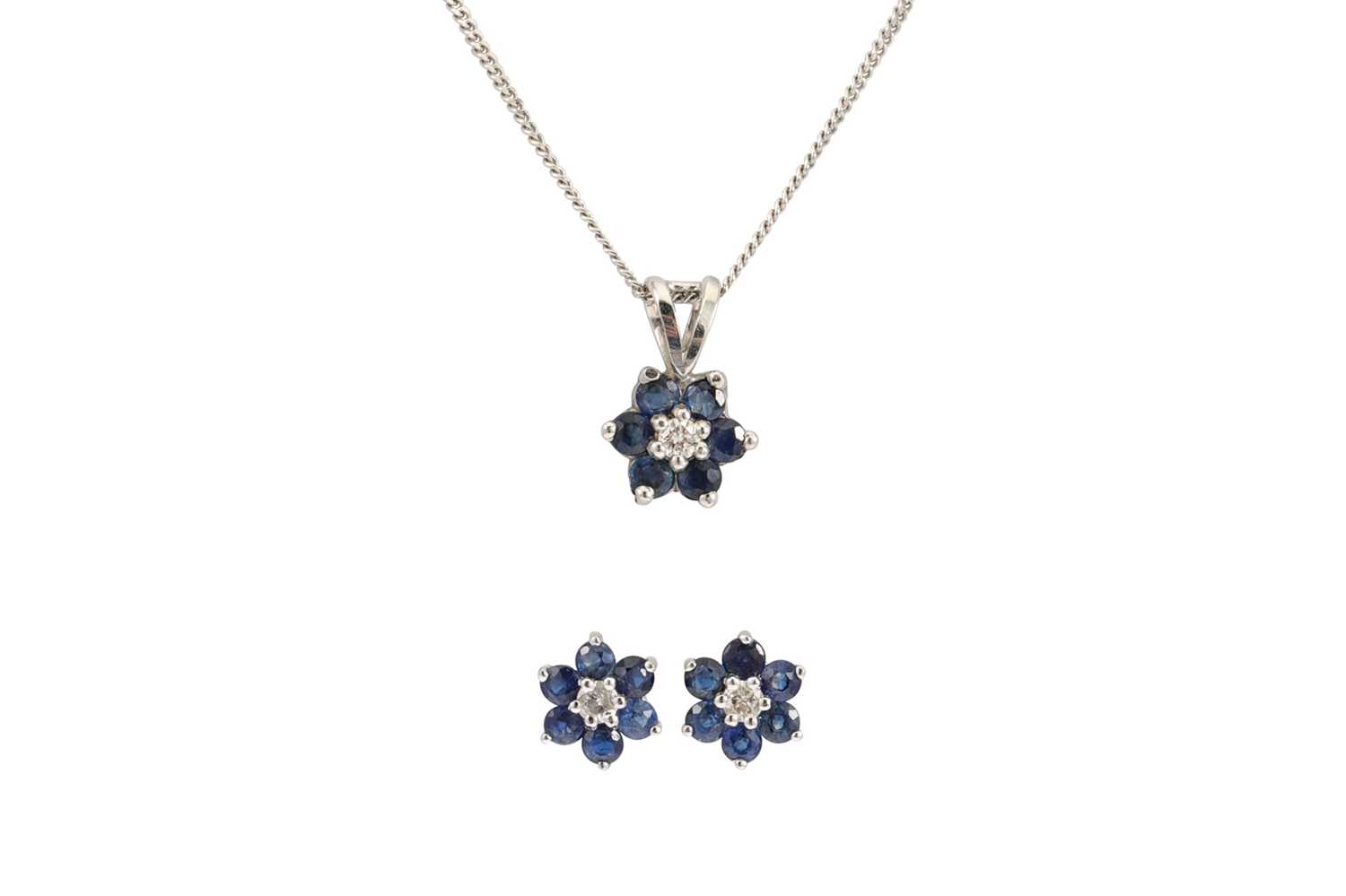 Lot 302 - A SAPPHIRE AND DIAMOND CLUSTER PENDANT, with...