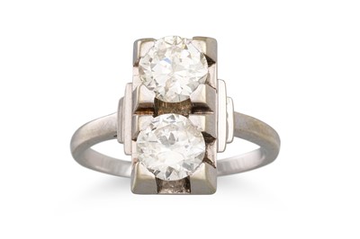 Lot 387 - A MID CENTURY DIAMOND RING, set with two old...