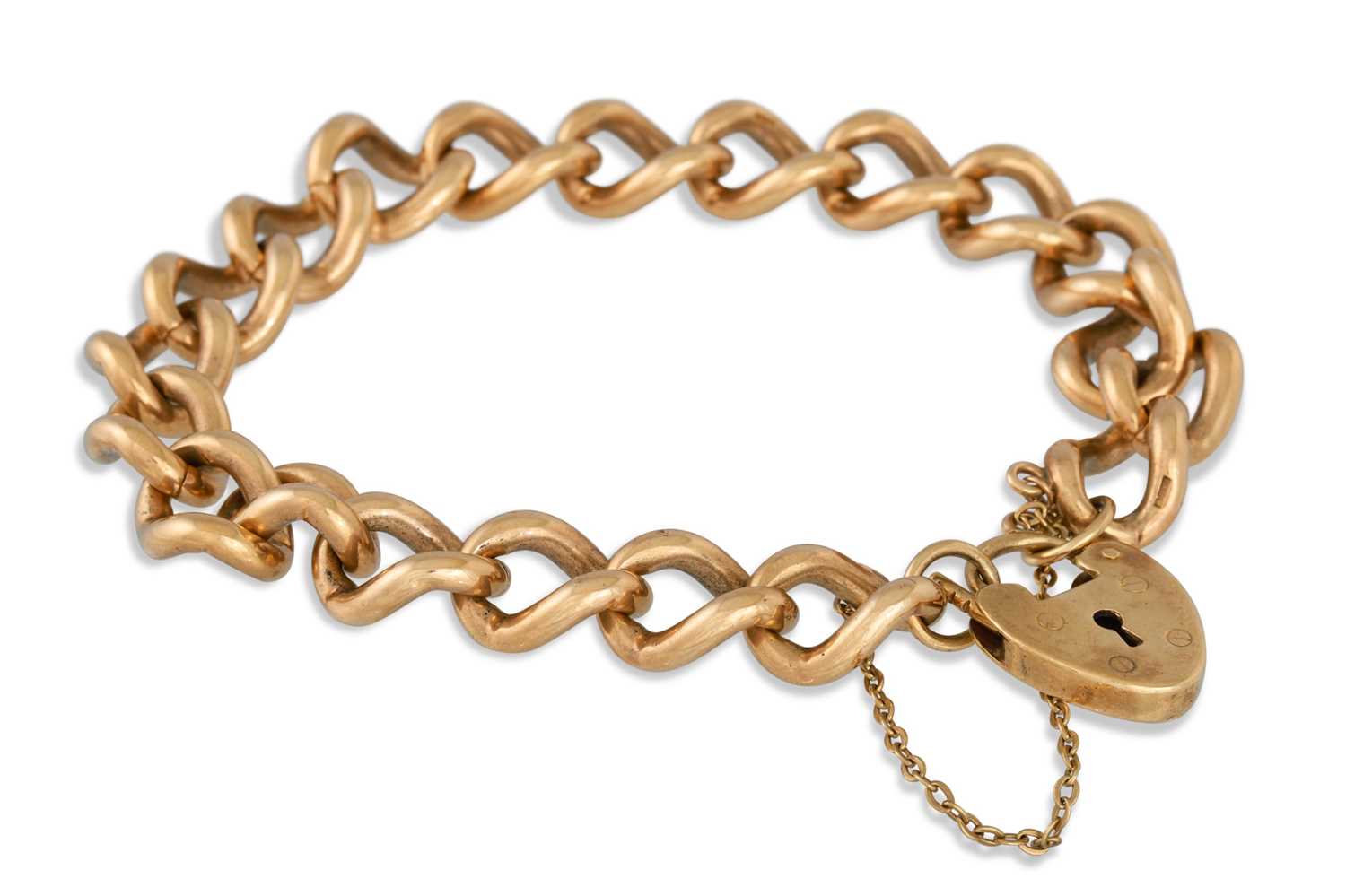 Lot 54 - A VINTAGE 9CT GOLD CURB LINK BRACELET, with a...