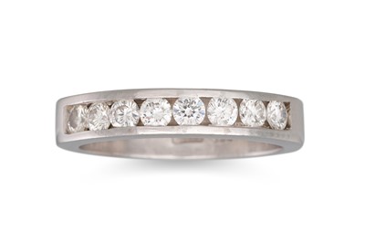 Lot 88 - A DIAMOND HALF ETERNITY RING, channel set in...