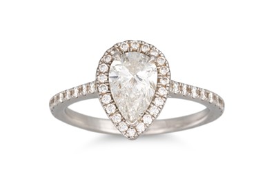 Lot 284 - A DIAMOND HALO CLUSTER RING, the pear shaped...