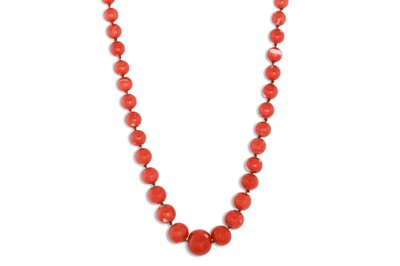 Lot 50 - A CORAL COLOURED BEADED GRADUATED NECKLACE, ca...