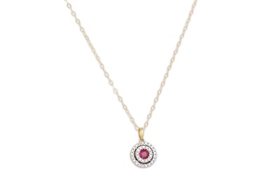Lot 21 - A DIAMOND AND RUBY PENDANT, mounted in yellow...