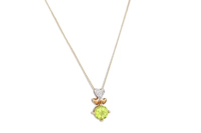 Lot 65 - A PERIDOT AND DIAMOND PENDANT, heart shaped,...