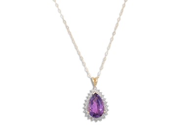 Lot 79 - AN AMETHYST AND DIAMOND PENDANT, the pear...