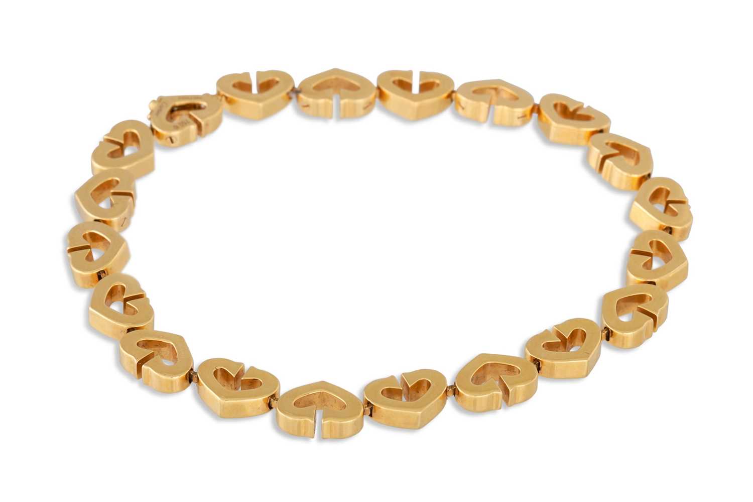 Lot 192 - AN 18CT GOLD CARTIER HEART BRACELET, serial...