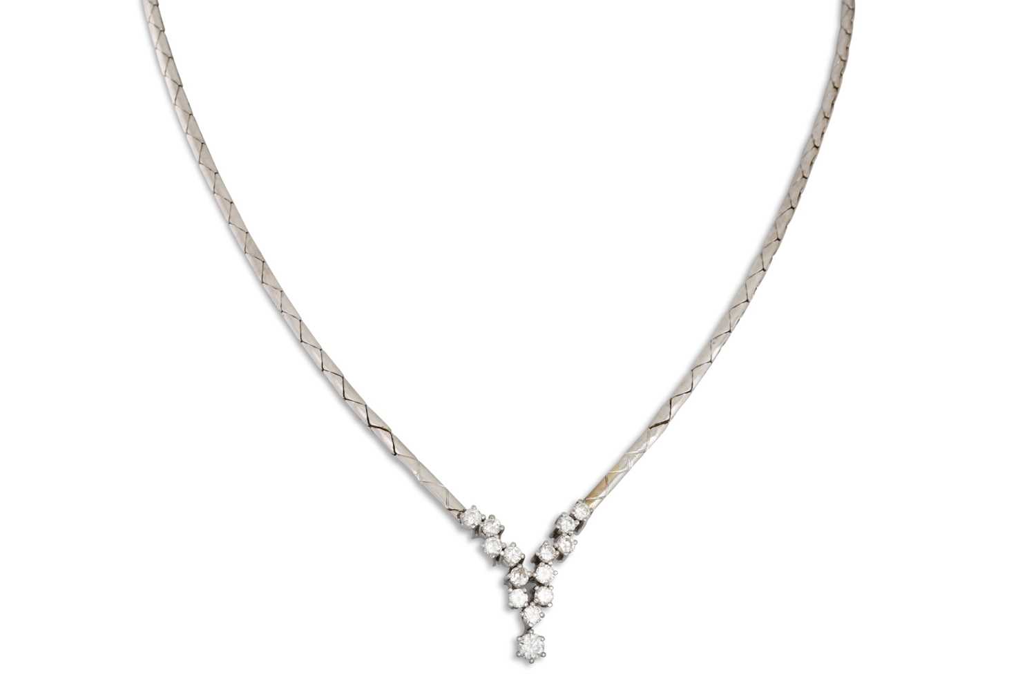 Lot 130 - A VINTAGE DIAMOND NECK PIECE, the central...