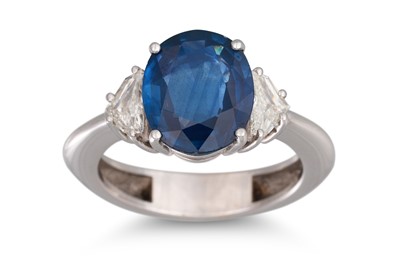 Lot 155 - A SAPPHIRE AND DIAMOND RING, the oval sapphire...