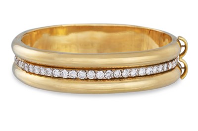 Lot 88 - A DIAMOND SET BANGLE, in 18ct white and yellow...