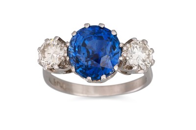 Lot 90 - A THREE STONE DIAMOND AND SAPPHIRE RING, the...